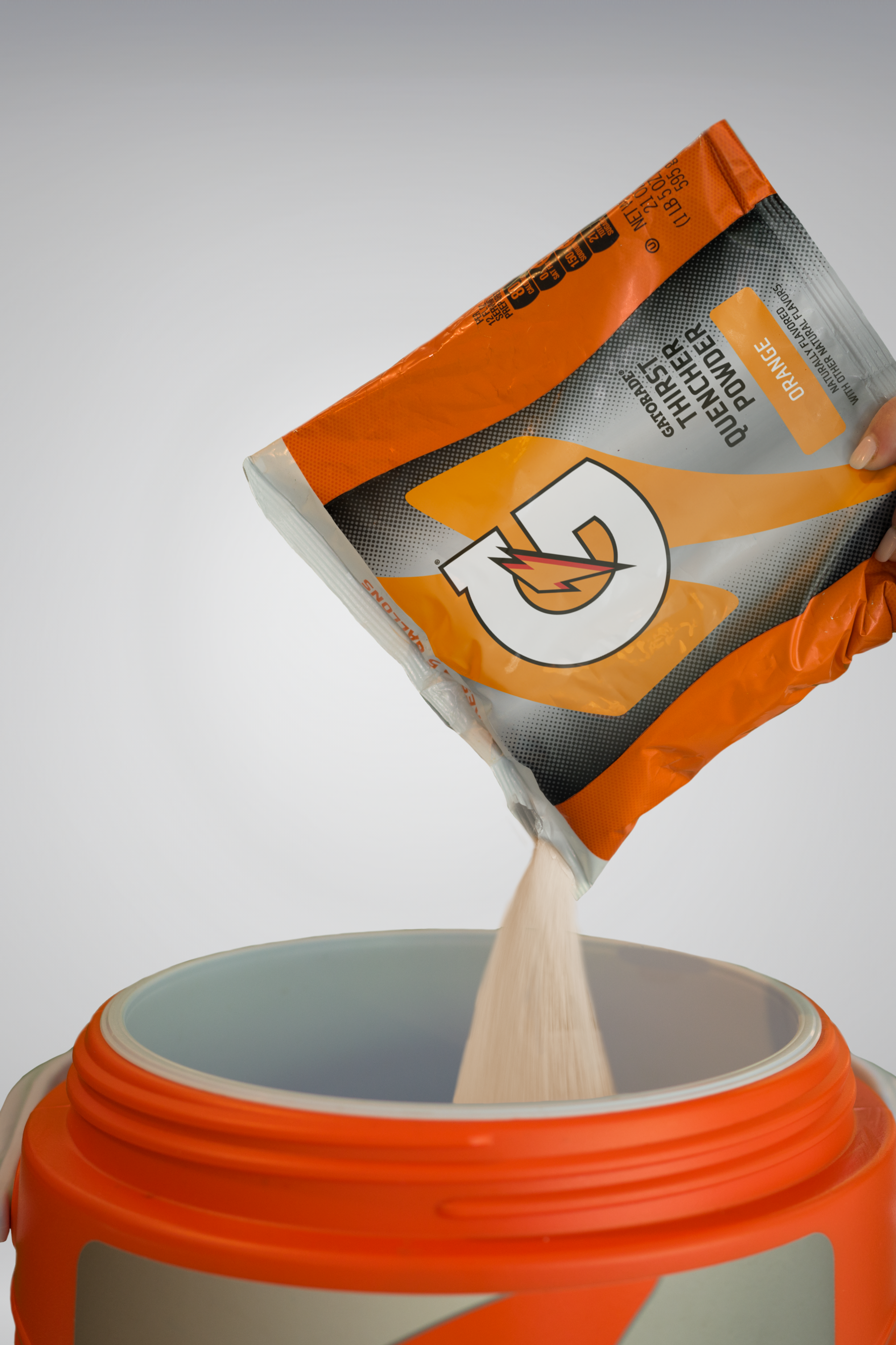 Gatorade powder mixed in team cooler for sideline hydration