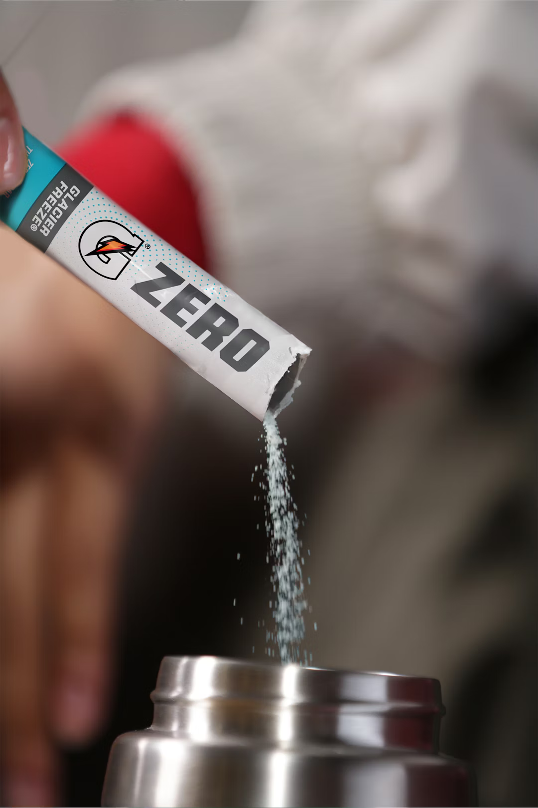 Gatorade G Zero mixing demonstration pouring a stick into a bottle