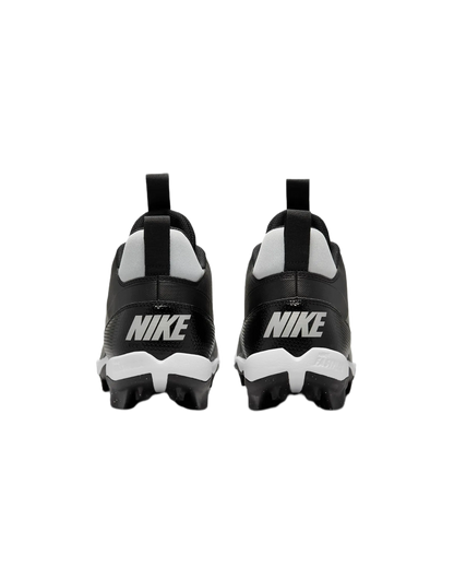 Rear view of black and white Nike Alpha Menace 4 Shark football cleats with Nike logo on heel and studded soles for traction