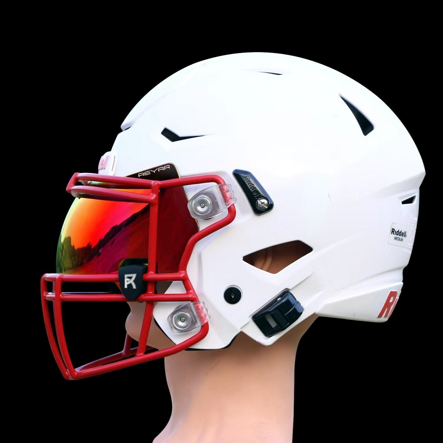 Reyrr VIZU Football Visor with ultra-wide clear lens and advanced LuxeXray Optics on a white Riddell Speedflex helmet with red facemask